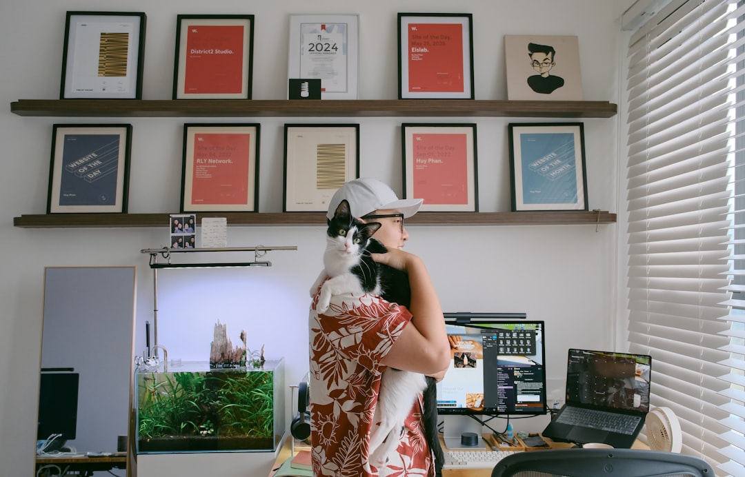 person working with cat